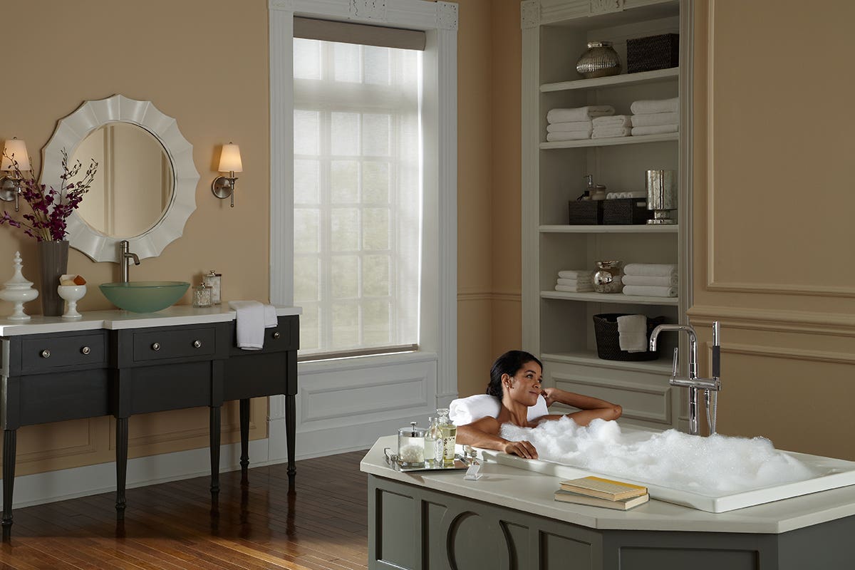 Woman in Bath with Fully Closed Sheer Roller Shades